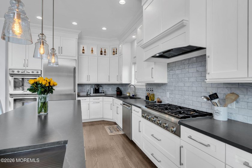 Welcome to this stunning 4-bedroom, 3 1/2-bath waterfront home - photo 6