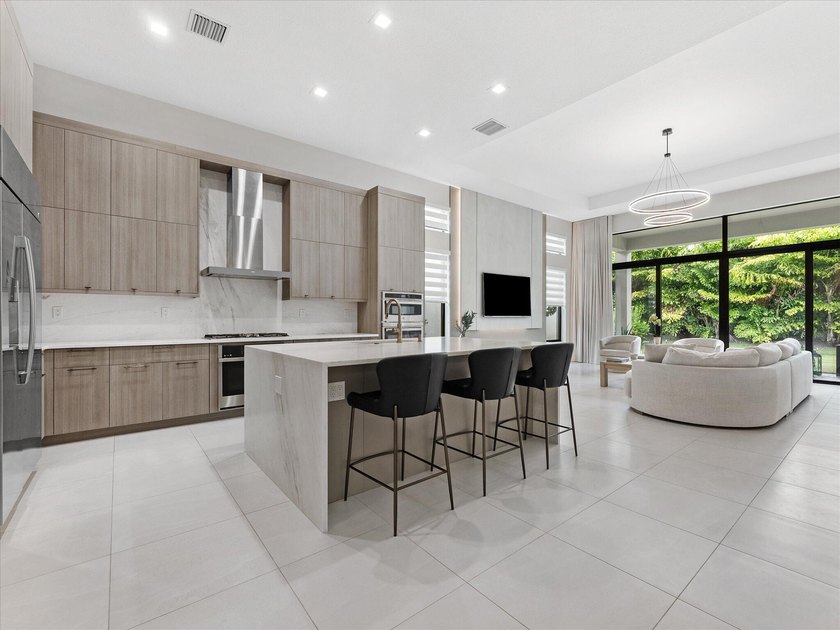 Welcome to this stunning 2025 built home in Lotus Edge, set on - photo 5