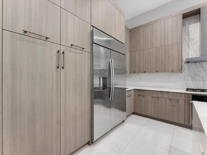Welcome to this stunning 2025 built home in Lotus Edge, set on - photo 7