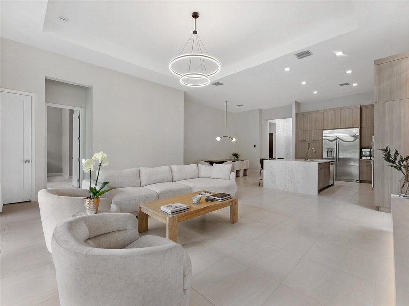 Welcome to this stunning 2025 built home in Lotus Edge, set on - photo 10