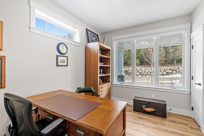 Luxury, low-maintenance living meets peaceful wooded privacy in - photo 13