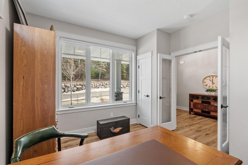 Luxury, low-maintenance living meets peaceful wooded privacy in - photo 14