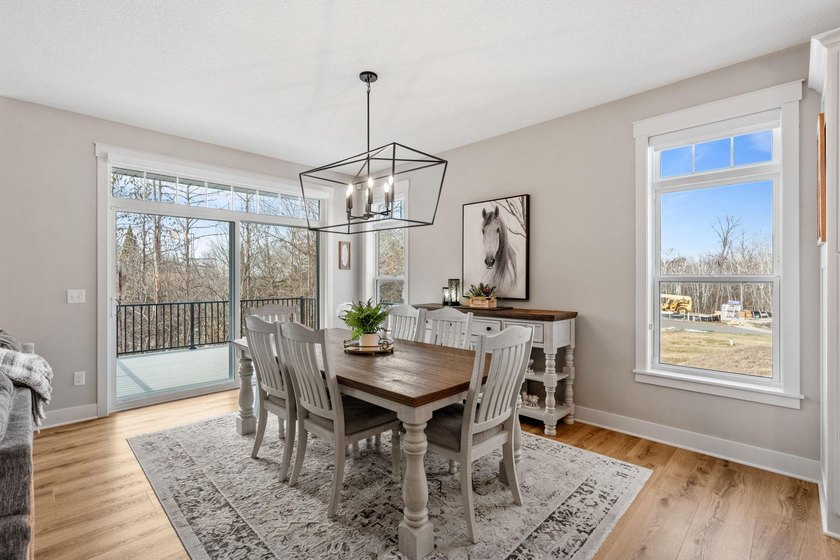 Luxury, low-maintenance living meets peaceful wooded privacy in - photo 16