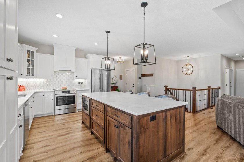 Luxury, low-maintenance living meets peaceful wooded privacy in - photo 17