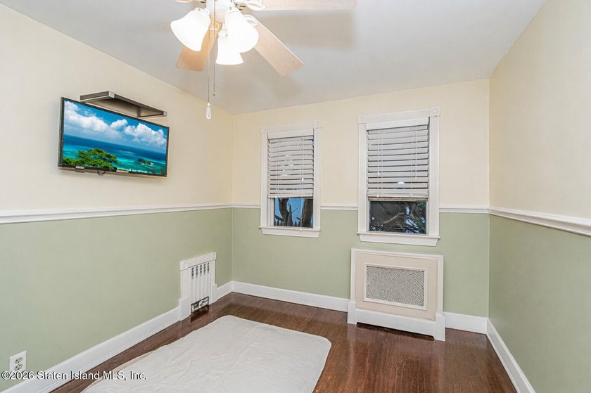 Welcome to this well-maintained three-family home in the highly - photo 22