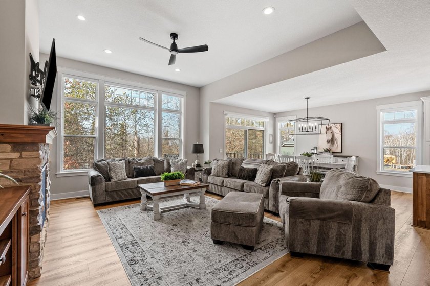 Luxury, low-maintenance living meets peaceful wooded privacy in - photo 24