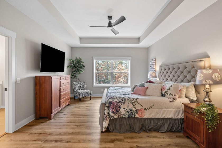 Luxury, low-maintenance living meets peaceful wooded privacy in - photo 26