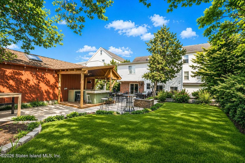 Welcome to this well-maintained three-family home in the highly - photo 29