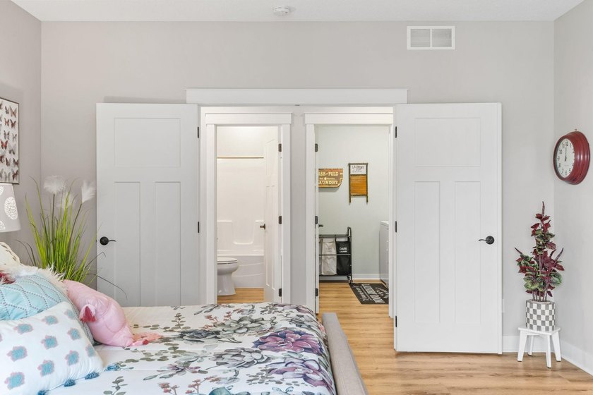 Luxury, low-maintenance living meets peaceful wooded privacy in - photo 30