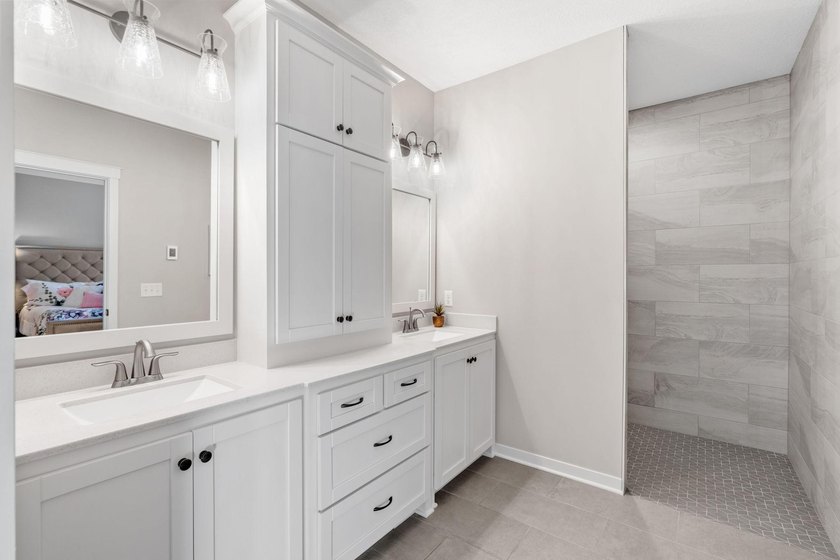 Luxury, low-maintenance living meets peaceful wooded privacy in - photo 31