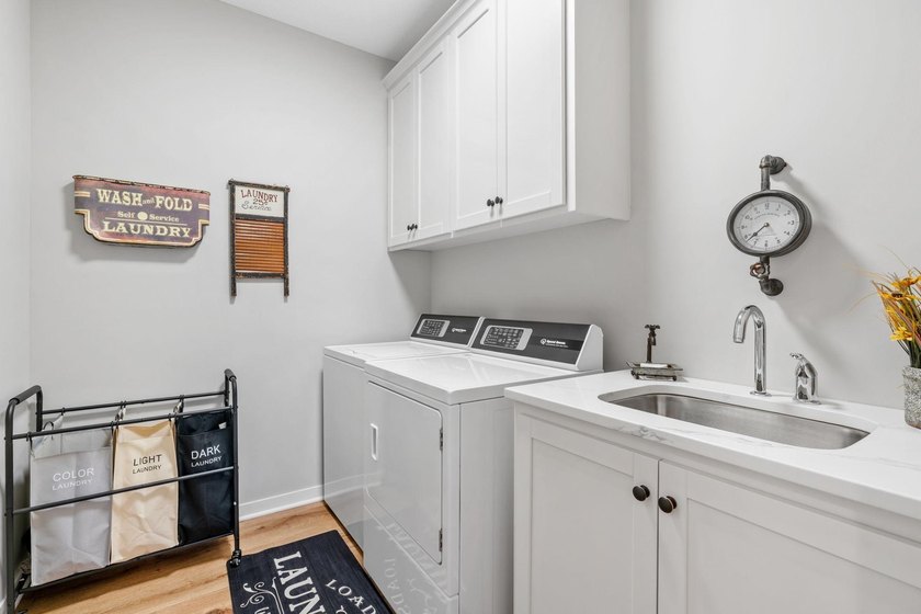 Luxury, low-maintenance living meets peaceful wooded privacy in - photo 35