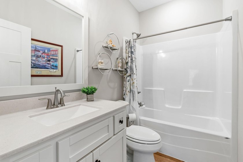 Luxury, low-maintenance living meets peaceful wooded privacy in - photo 36