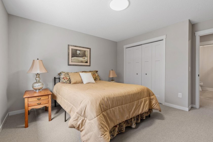Luxury, low-maintenance living meets peaceful wooded privacy in - photo 45