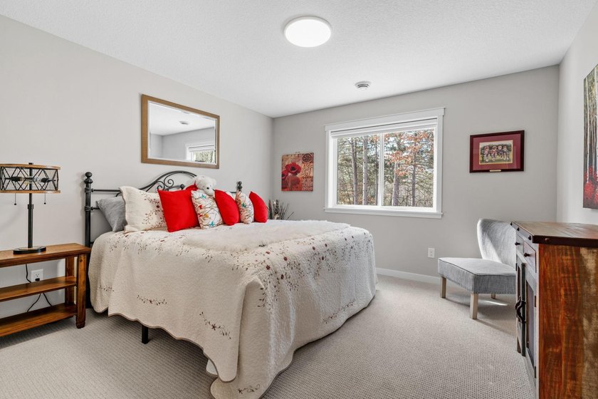 Luxury, low-maintenance living meets peaceful wooded privacy in - photo 46