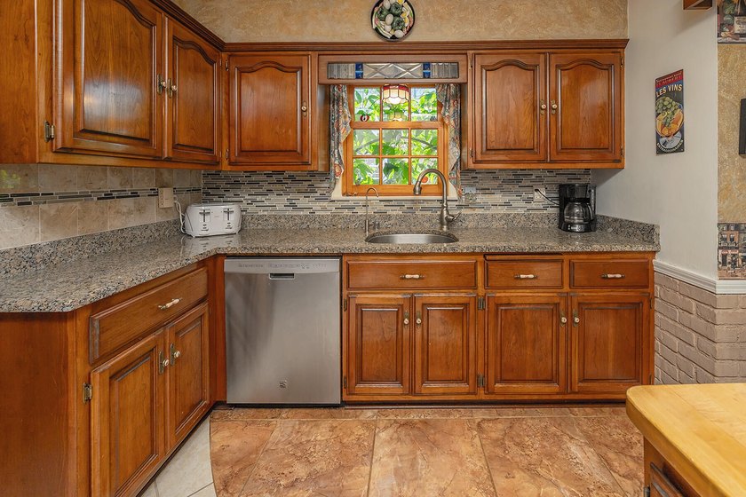 Your'e gonna love this handsome brick colonial nestled on a - photo 16