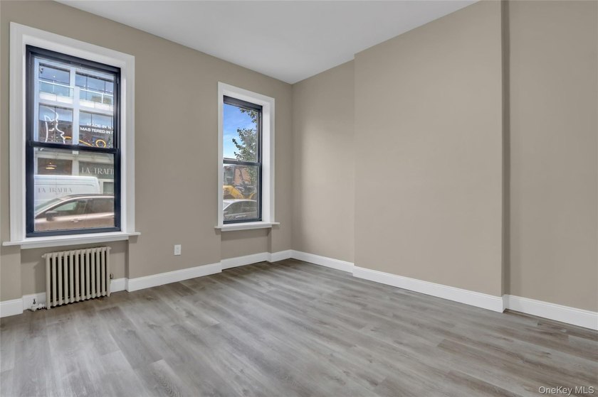 This attractive triplex has a beautifully restored facade that - photo 4