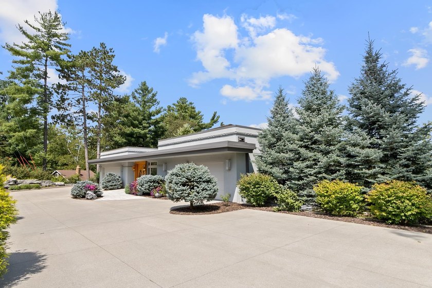 This stunning ranch home, designed by James R. Dresser in the - photo 5