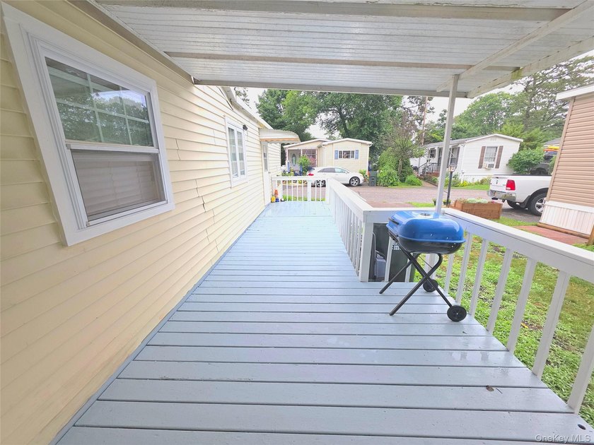 This charming 2-bedroom, 1-bath mobile home is located in a - photo 3