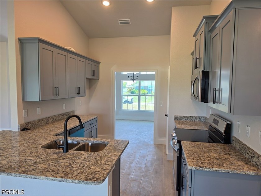 NEW CONSTRUCTION IN DESIRABLE NW CAPE CORAL! Welcome to your - photo 3