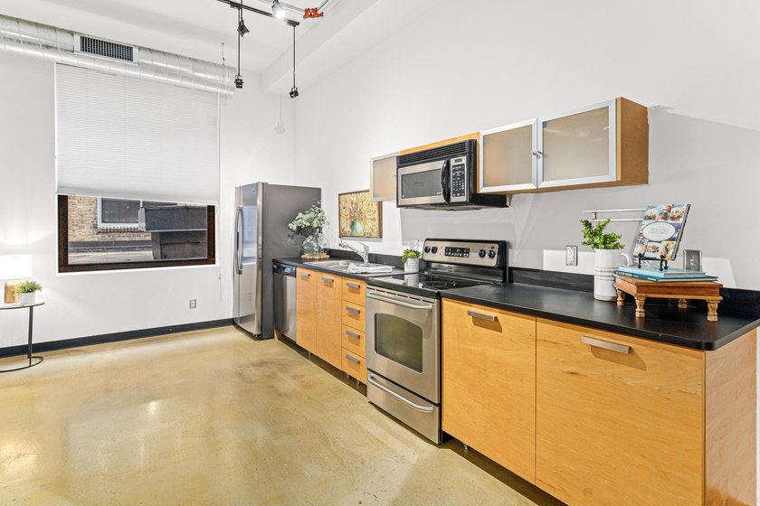 Welcome to the epitome of downtown living! The historic Lowry - photo 2