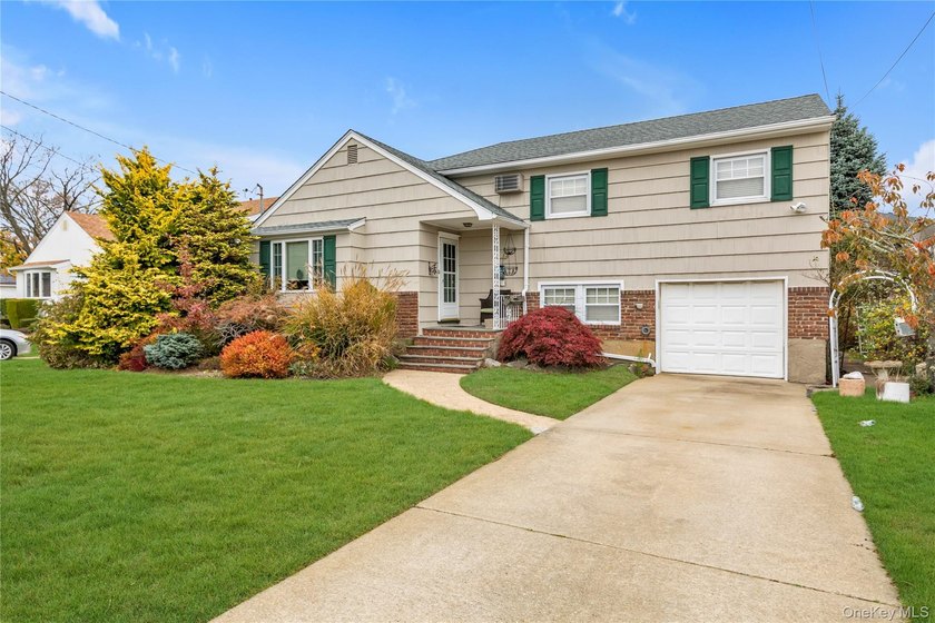 Welcome to this beautifully maintained split-level home located - photo 2