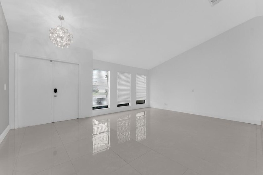 This stunning 4-bedroom, 2-bath pool home in the heart of Coral - photo 8