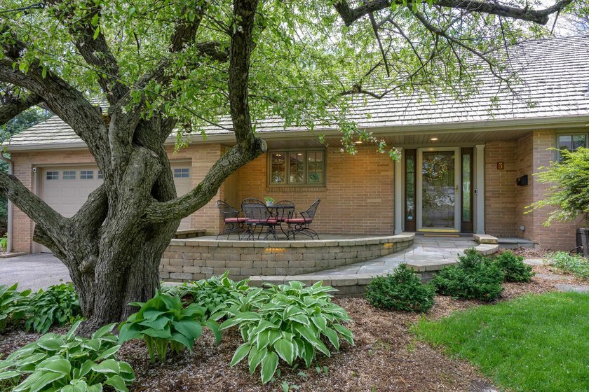 OPEN HOUSE CANCELED! Tucked into a beautiful village setting - photo 4