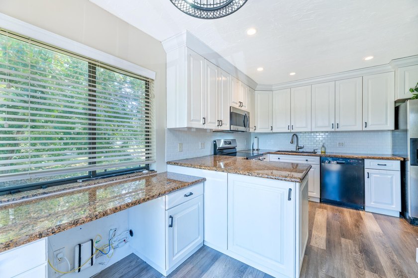 Welcome to this beautifully maintained two-story condominium in - photo 7