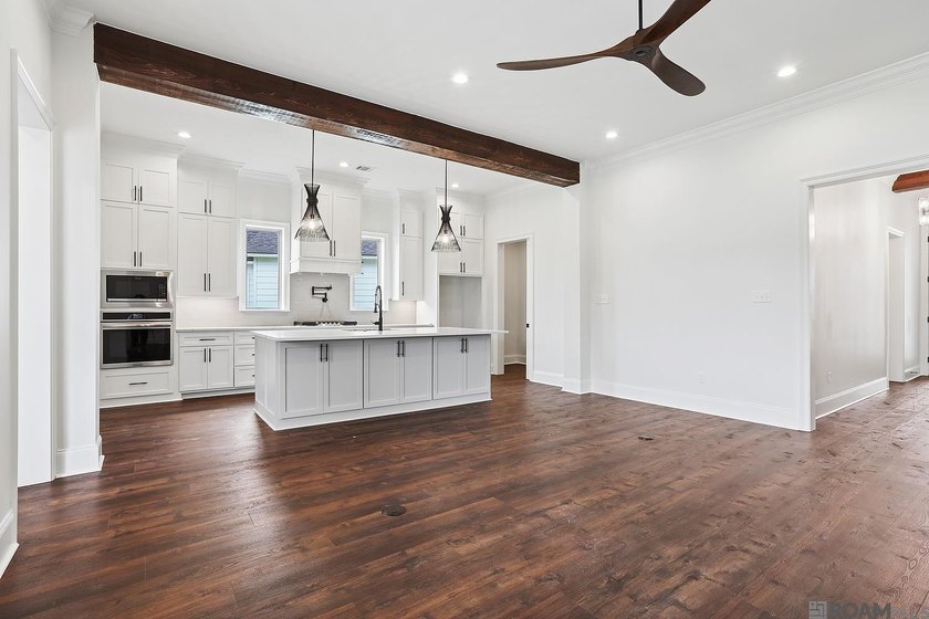 Welcome to this beautifully designed 4-bedroom, 3-bath home in - photo 3