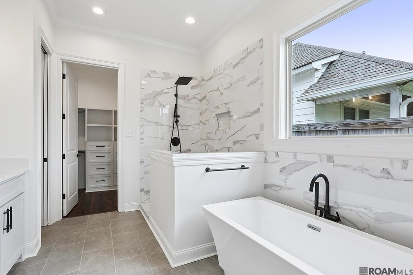 Welcome to this beautifully designed 4-bedroom, 3-bath home in - photo 6