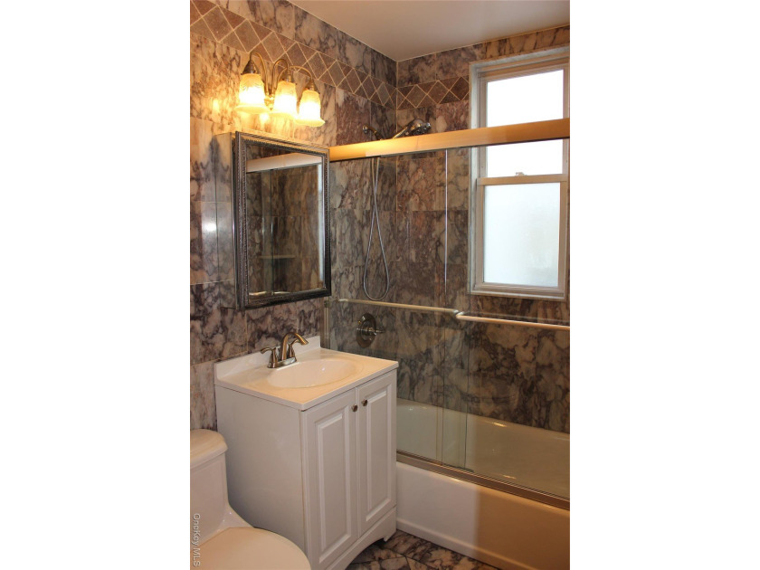 Welcome to 2973 Harding Avenue, a beautifully maintained - photo 8
