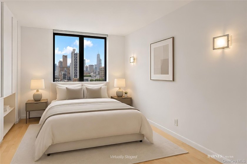 Perched on a high floor with breathtaking skyline views, this - photo 4