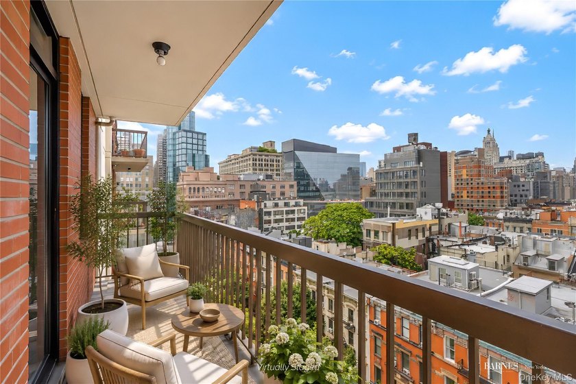 Perched on a high floor with breathtaking skyline views, this - photo 6