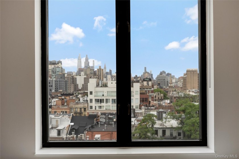 Perched on a high floor with breathtaking skyline views, this - photo 10