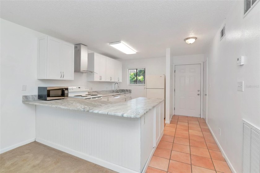 Enjoy easy, low-maintenance Florida living in this attractive - photo 11