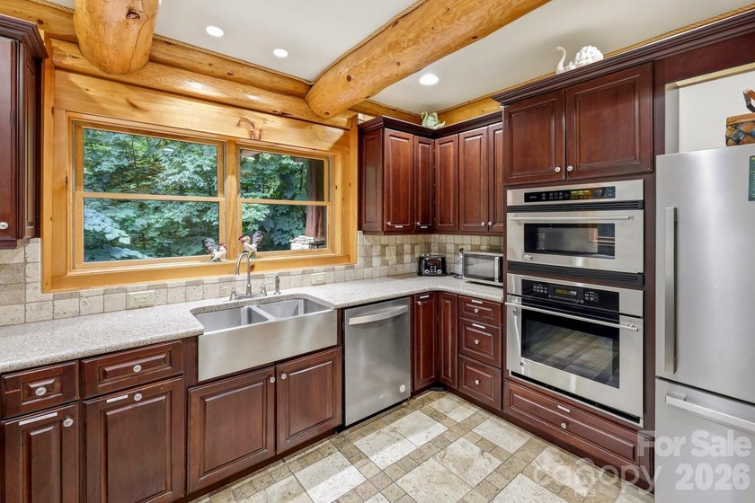 Stunning custom log home nestled on over 3 acres in the shadow - photo 12