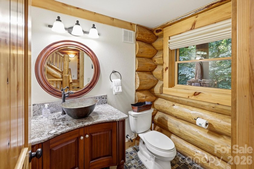 Stunning custom log home nestled on over 3 acres in the shadow - photo 15