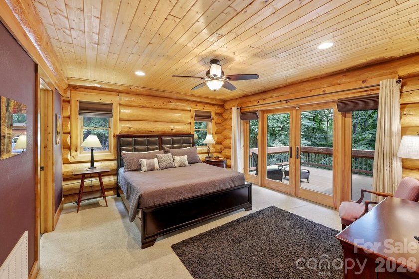 Stunning custom log home nestled on over 3 acres in the shadow - photo 16