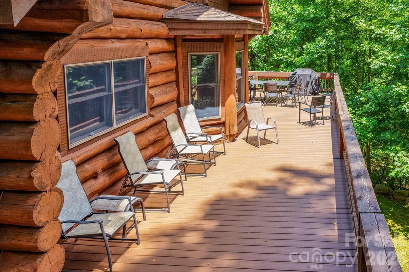 Stunning custom log home nestled on over 3 acres in the shadow - photo 39