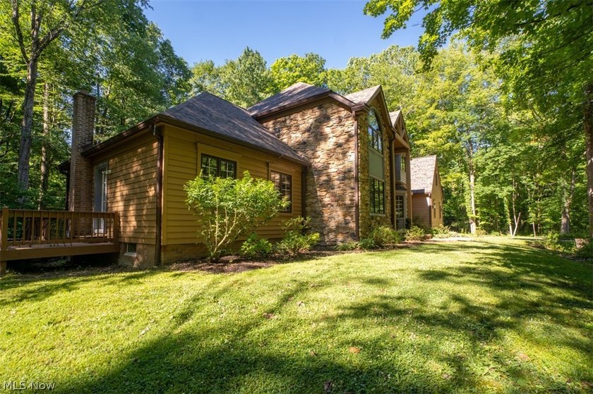 Tucked back on 5.09 wooded acres, this home offers the kind of - photo 2