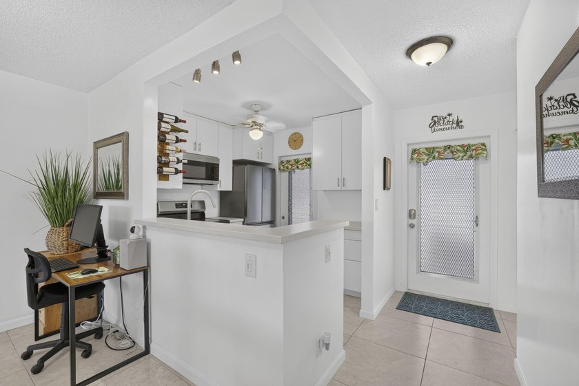 Beautifully updated 2-bedroom, 2-bath first-floor corner unit in - photo 11