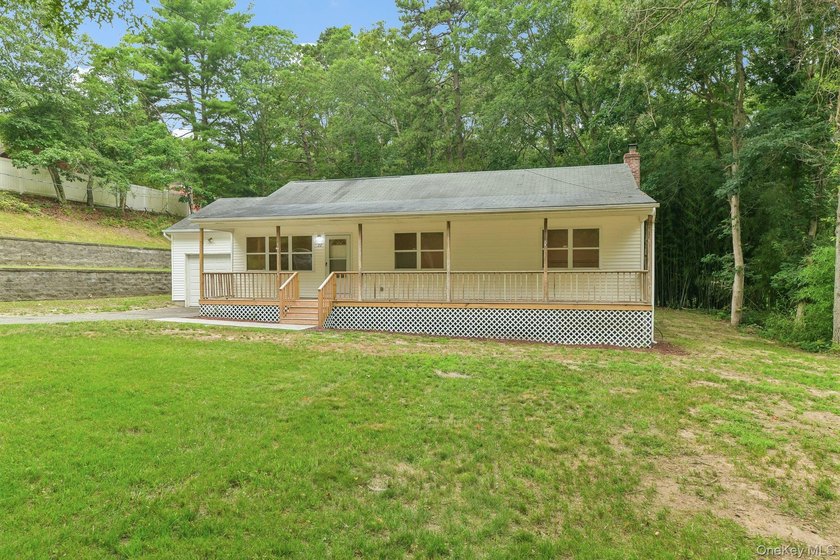 Tucked away on just over an acre in a private, wooded setting - photo 3