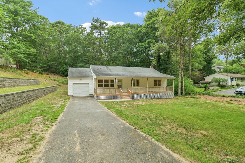 Tucked away on just over an acre in a private, wooded setting - photo 4