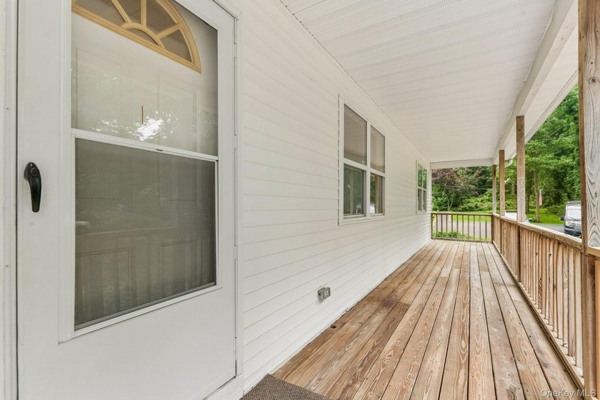 Tucked away on just over an acre in a private, wooded setting - photo 5
