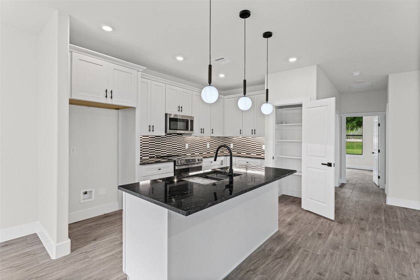 Discover this stunning brand-new 4-bedroom, 2-bathroom home in - photo 8