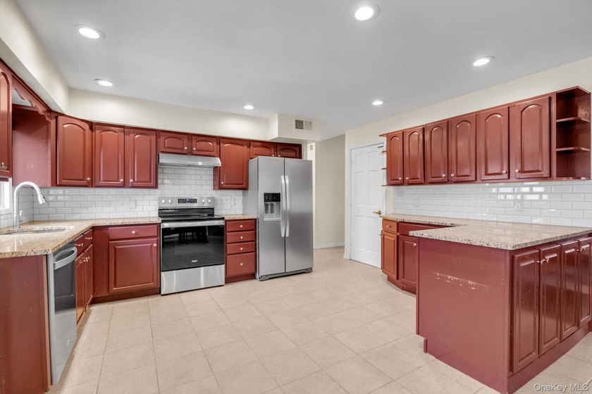 Nestled on a quiet, tree-lined street in a highly desirable - photo 7