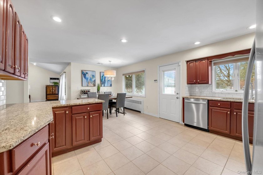Nestled on a quiet, tree-lined street in a highly desirable - photo 8