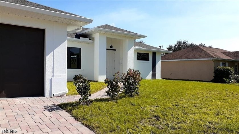 Welcome to this beautiful home located at 1201 NE 18th Pl, Cape - photo 2