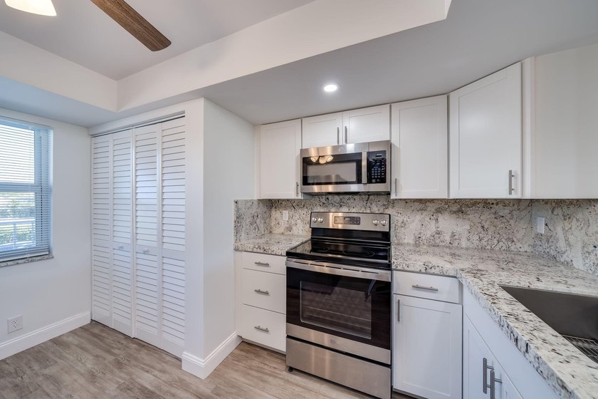Nestled in a vibrant 55+ community, this completely remodeled in - photo 7