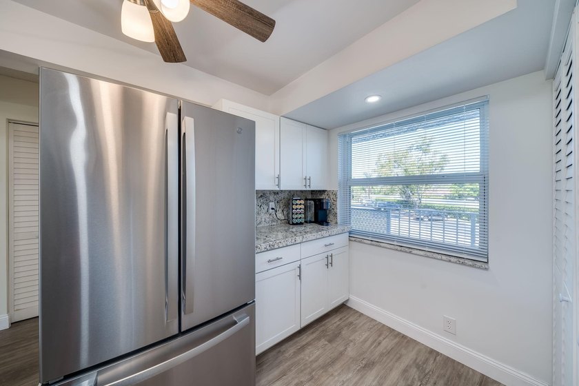 Nestled in a vibrant 55+ community, this completely remodeled in - photo 8